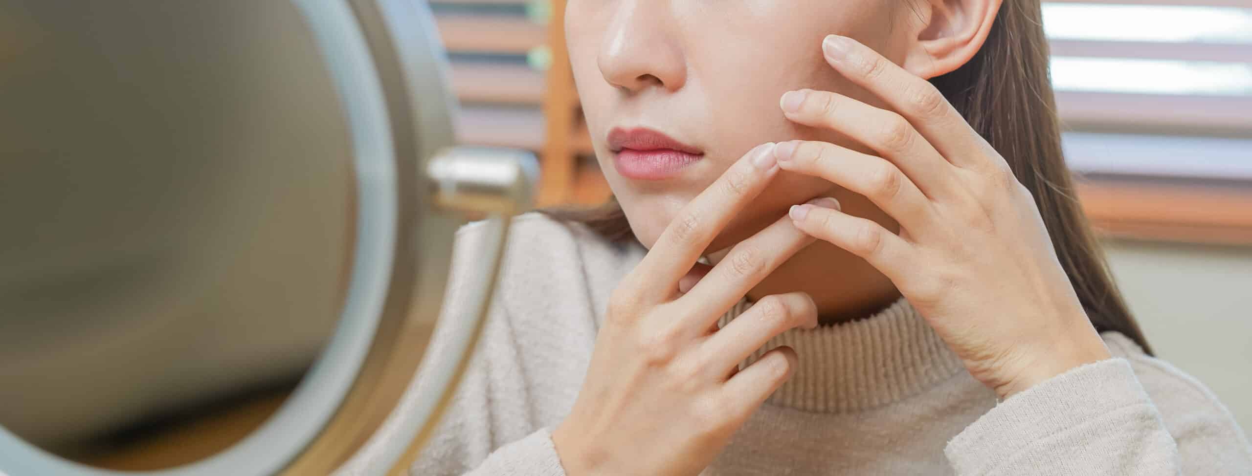Girl looking into mirror