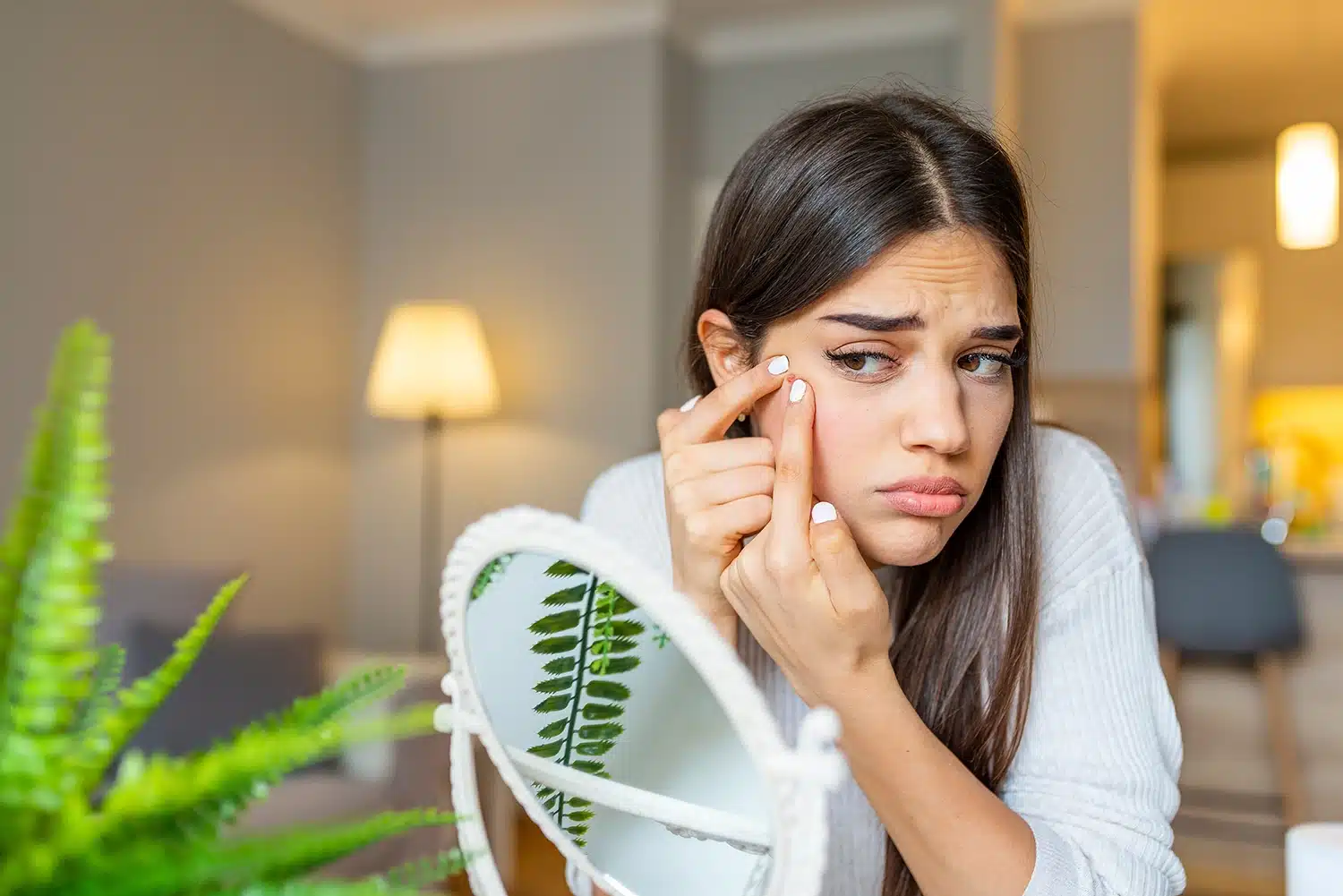 Girl squeezing pimple