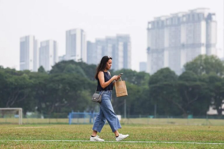 Woman walking outdoors on a hazy day in Singapore